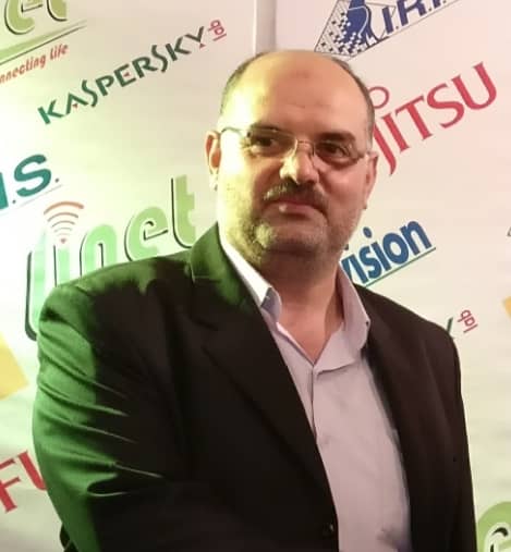 professional headshot of middle eastern business executive, confident expression, formal suit, finance background